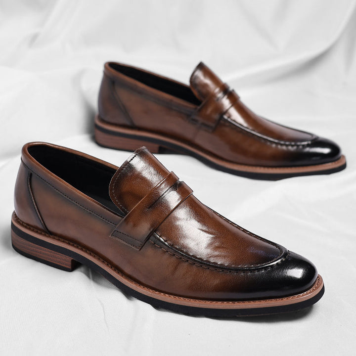 Men's penny loafer with polished finish, round toe and low heel