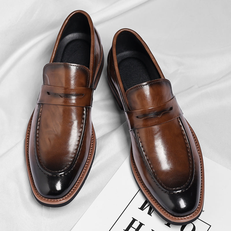Men's penny loafer with polished finish, round toe and low heel