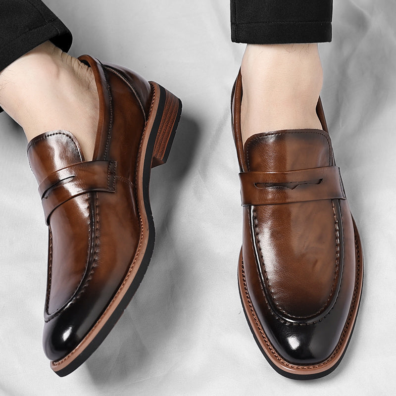 Men's penny loafer with polished finish, round toe and low heel