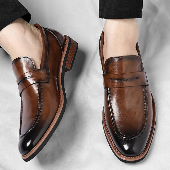 Men's penny loafer with polished finish, round toe and low heel