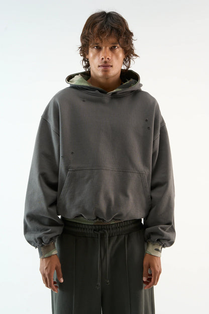 Distressed camouflage hoodie with hood, long sleeves and front pouch pocket