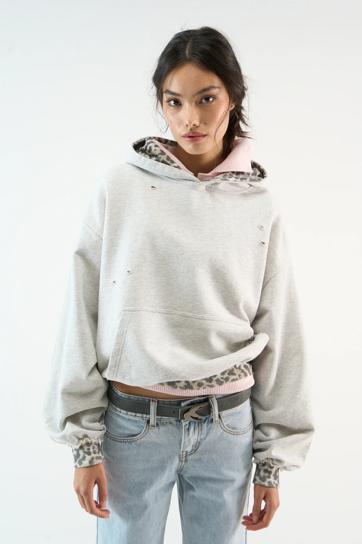 Distressed camouflage hoodie with hood, long sleeves and front pouch pocket