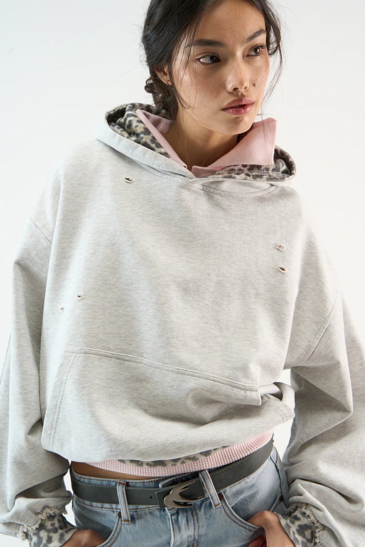 Distressed camouflage hoodie with hood, long sleeves and front pouch pocket