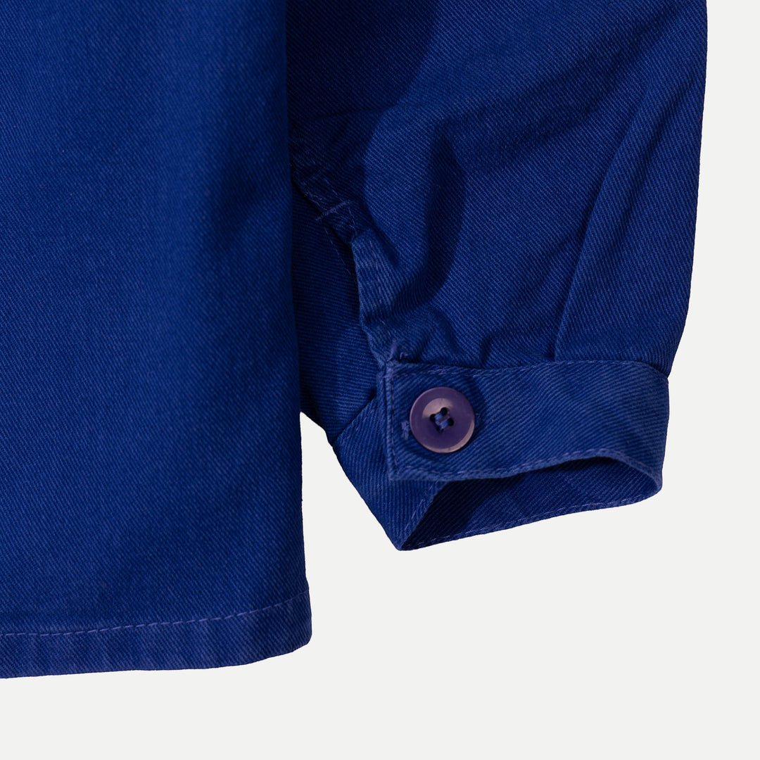 Men's blue collared work jacket with button front and patch pockets