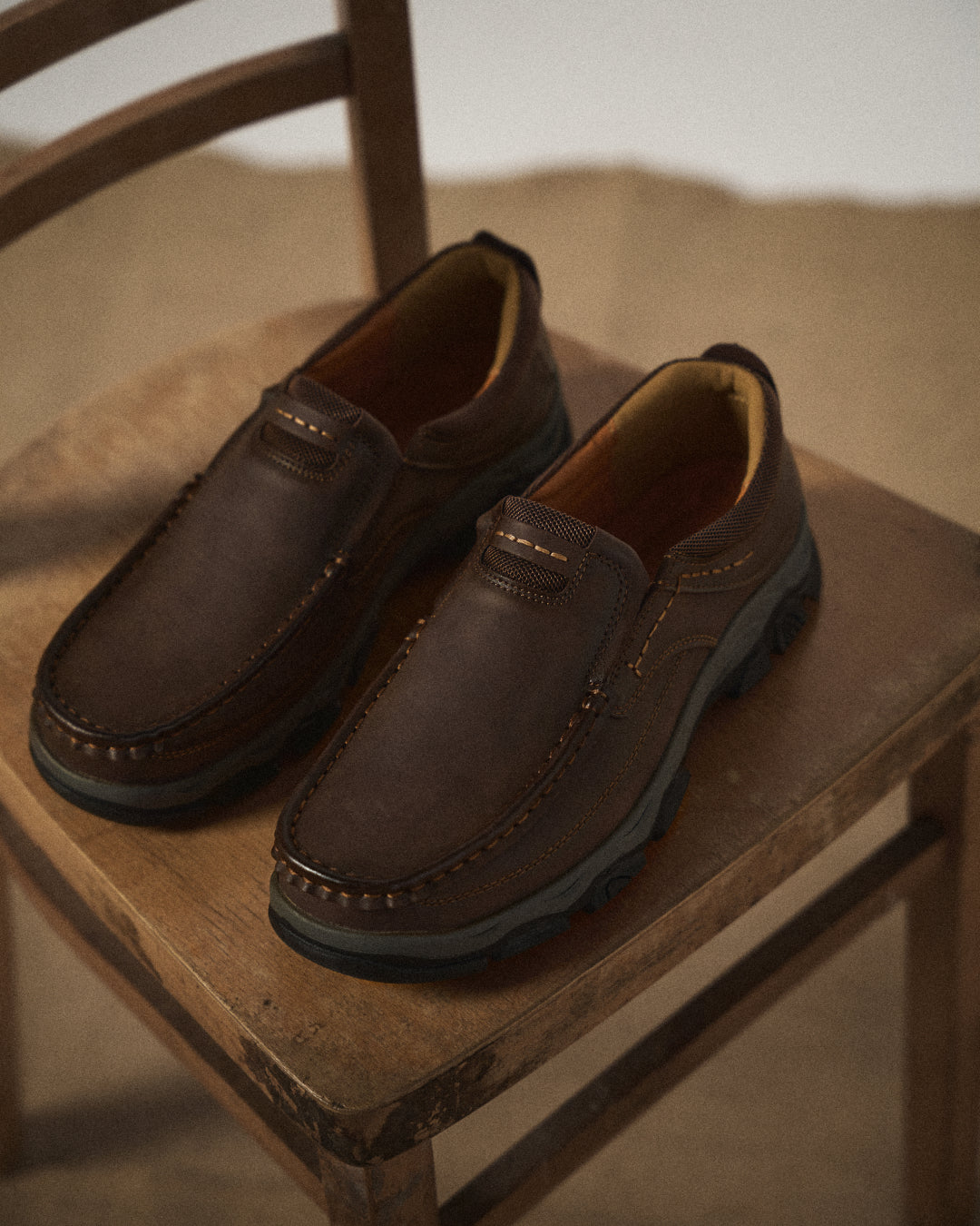 Men's moc toe loafers with contrast stitching and chunky lug soles