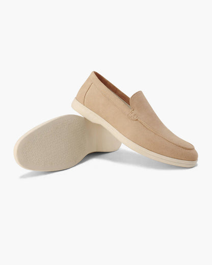 Slip-on loafers with almond toes, moc stitching and raised wedge soles