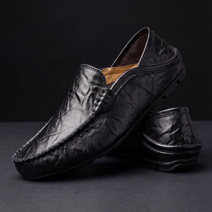 Unisex moc-toe loafers with stitched trim and flat soles