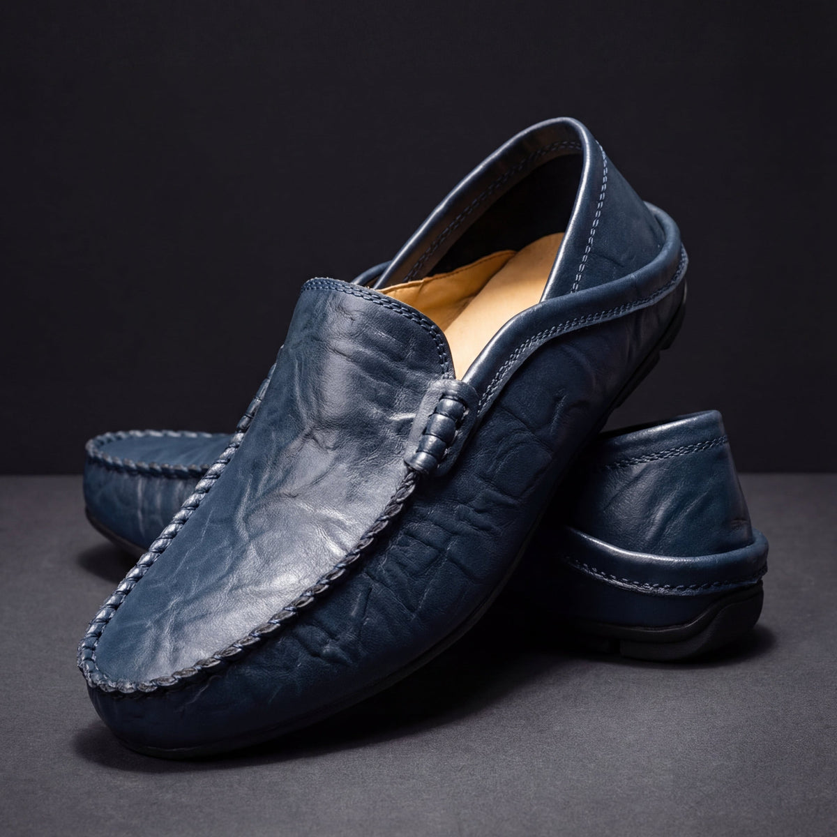 Unisex moc-toe loafers with stitched trim and flat soles