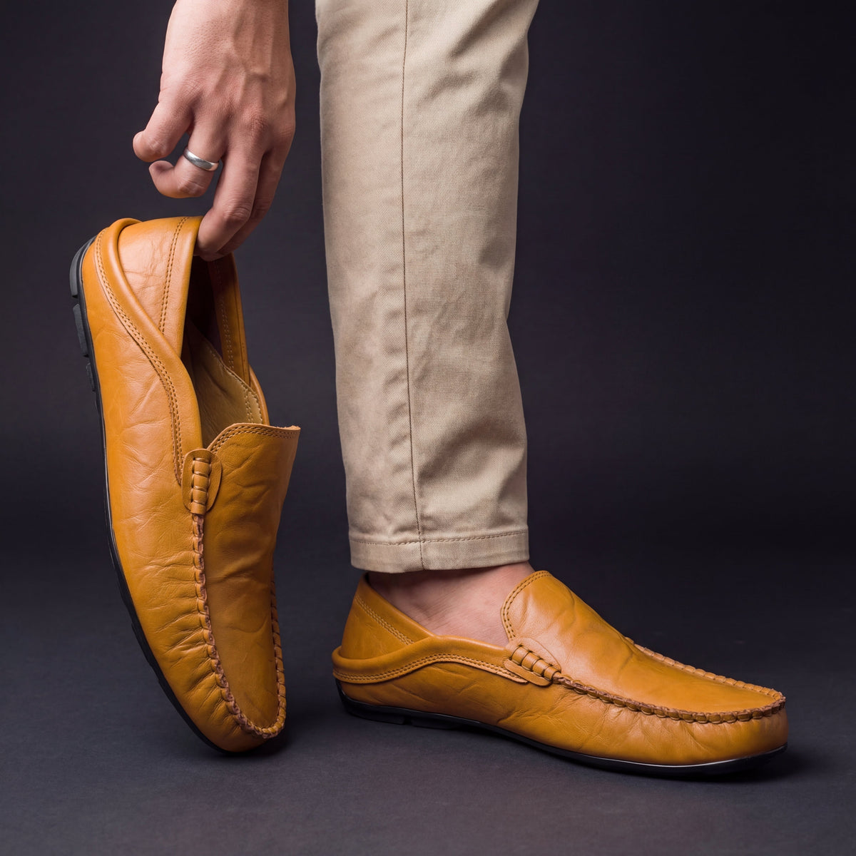 Unisex moc-toe loafers with stitched trim and flat soles