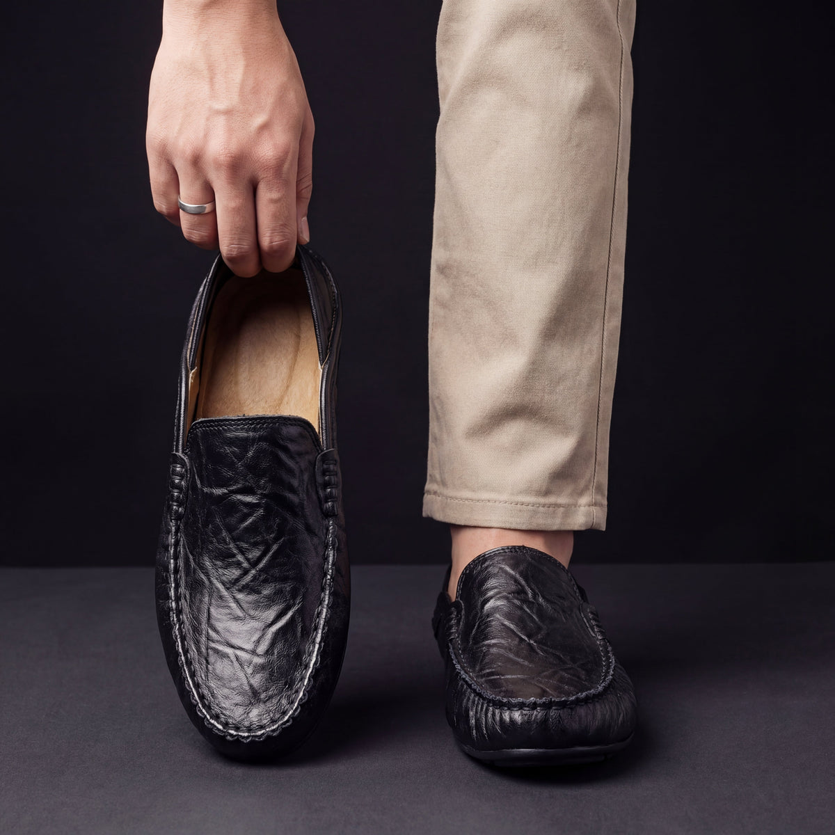 Unisex moc-toe loafers with stitched trim and flat soles