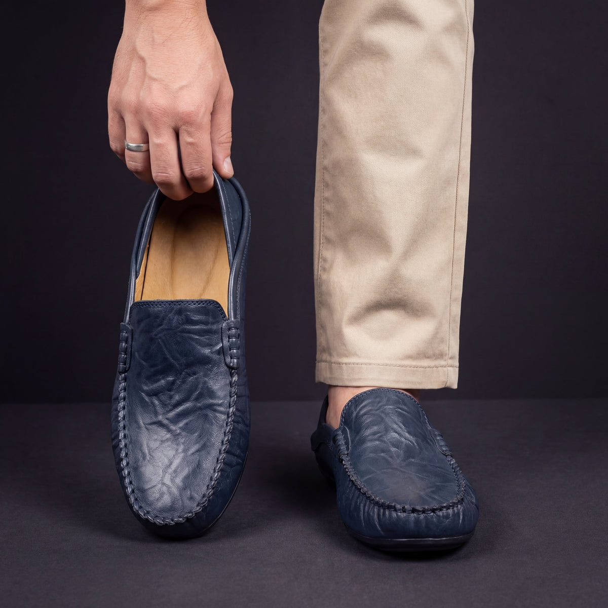 Unisex moc-toe loafers with stitched trim and flat soles
