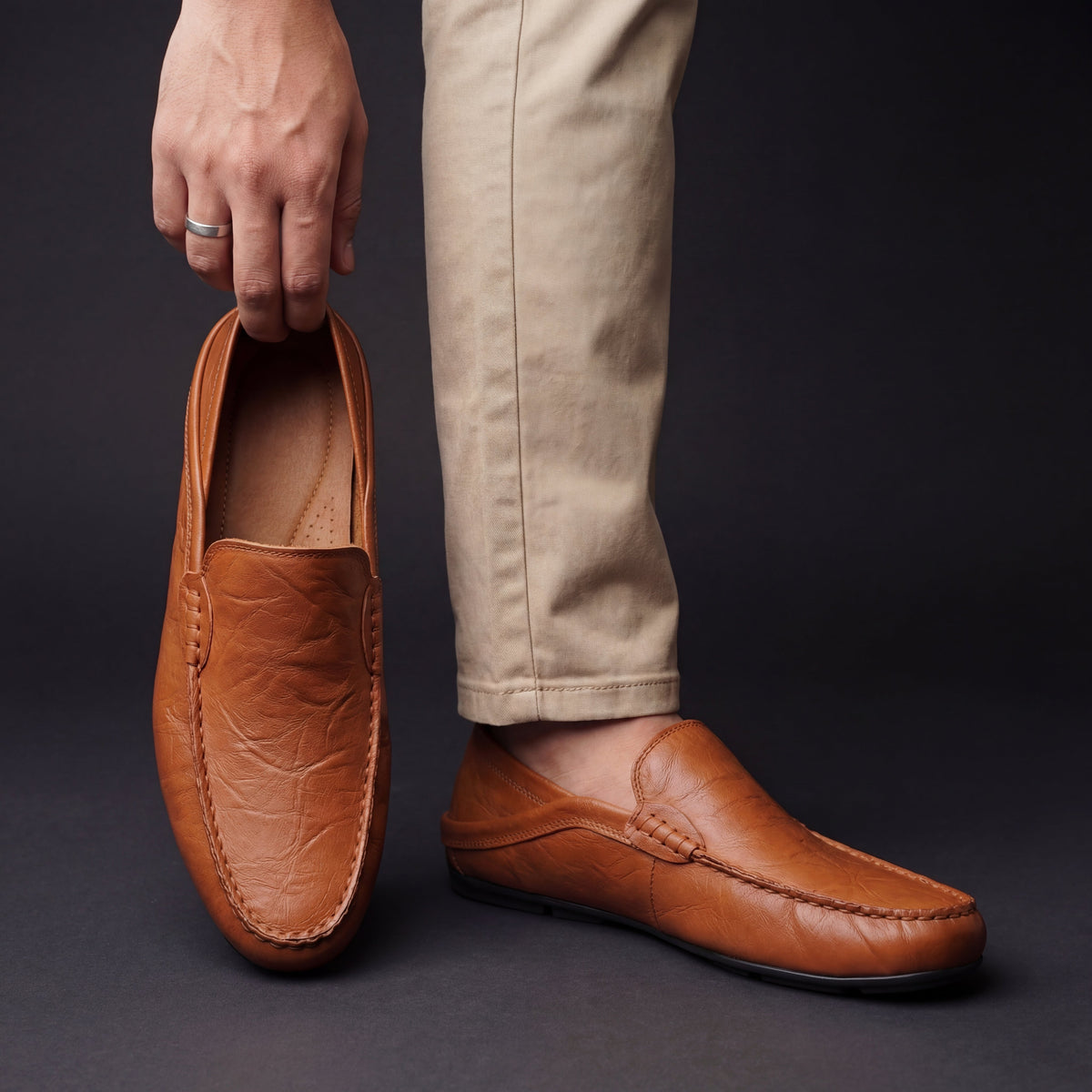 Unisex moc-toe loafers with stitched trim and flat soles