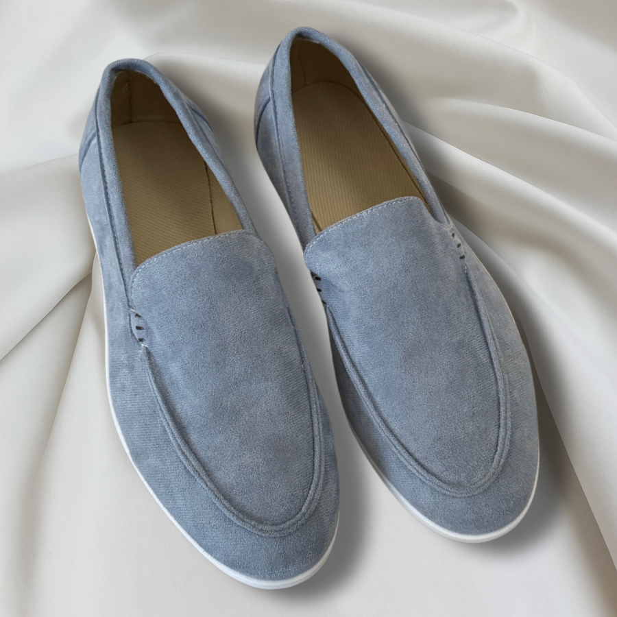 Black and navy suede loafers with cream sole and moc-toe stitching