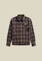 Brown checked long sleeve shirt with chest pocket, back graphic and decorative appliqué details