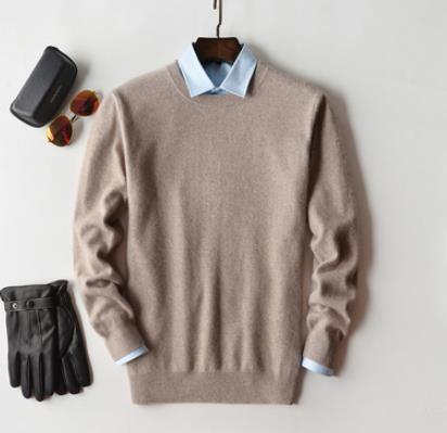 Solid crew neck sweater with long sleeves and ribbed trims layered over a collared shirt