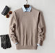 Solid crew neck sweater with long sleeves and ribbed trims layered over a collared shirt