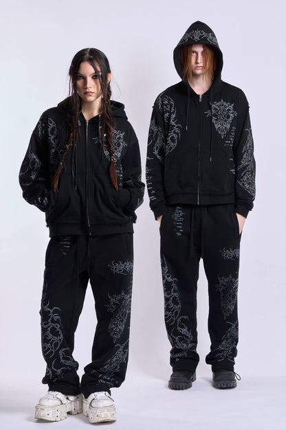 Black unisex zip hoodie with hood, long sleeves and contrasting graphic prints