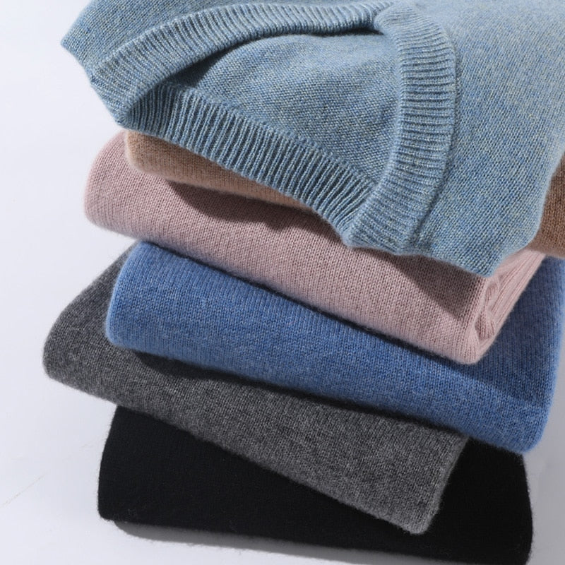 Solid crew neck sweater with long sleeves and ribbed trims layered over a collared shirt