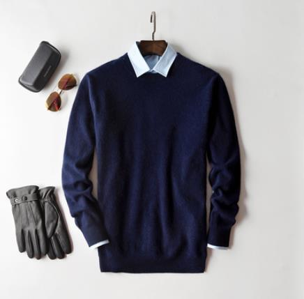 Solid crew neck sweater with long sleeves and ribbed trims layered over a collared shirt