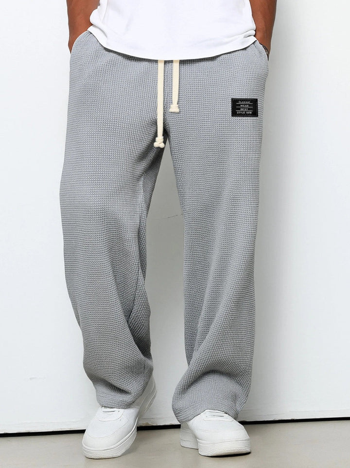 Men's relaxed fit trousers with drawstring waist in blue textured weave