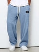 Men's blue textured sweatpants with drawstring waist and relaxed fit