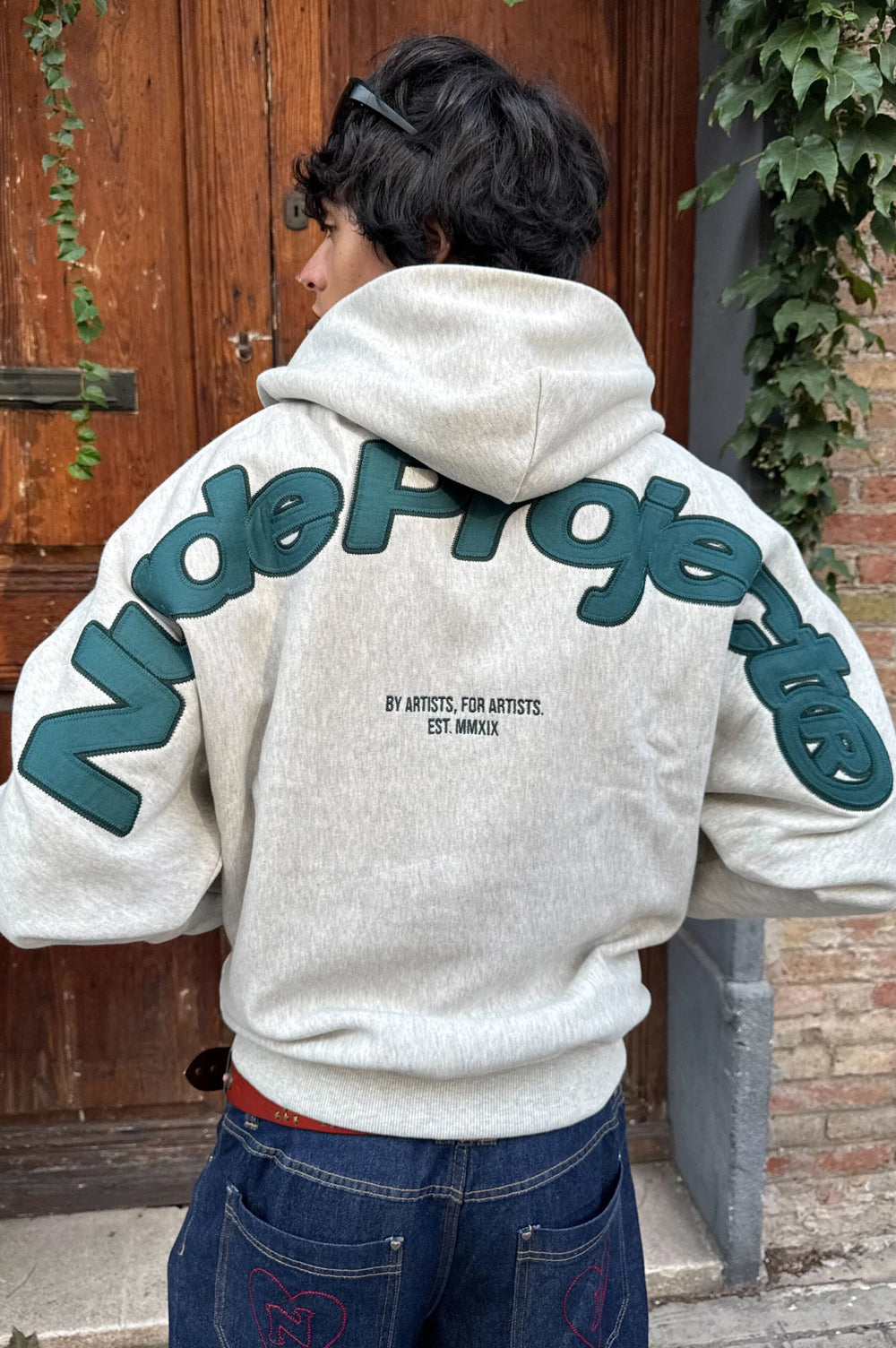 Grey graphic zip-up hoodie with hood and lettering
