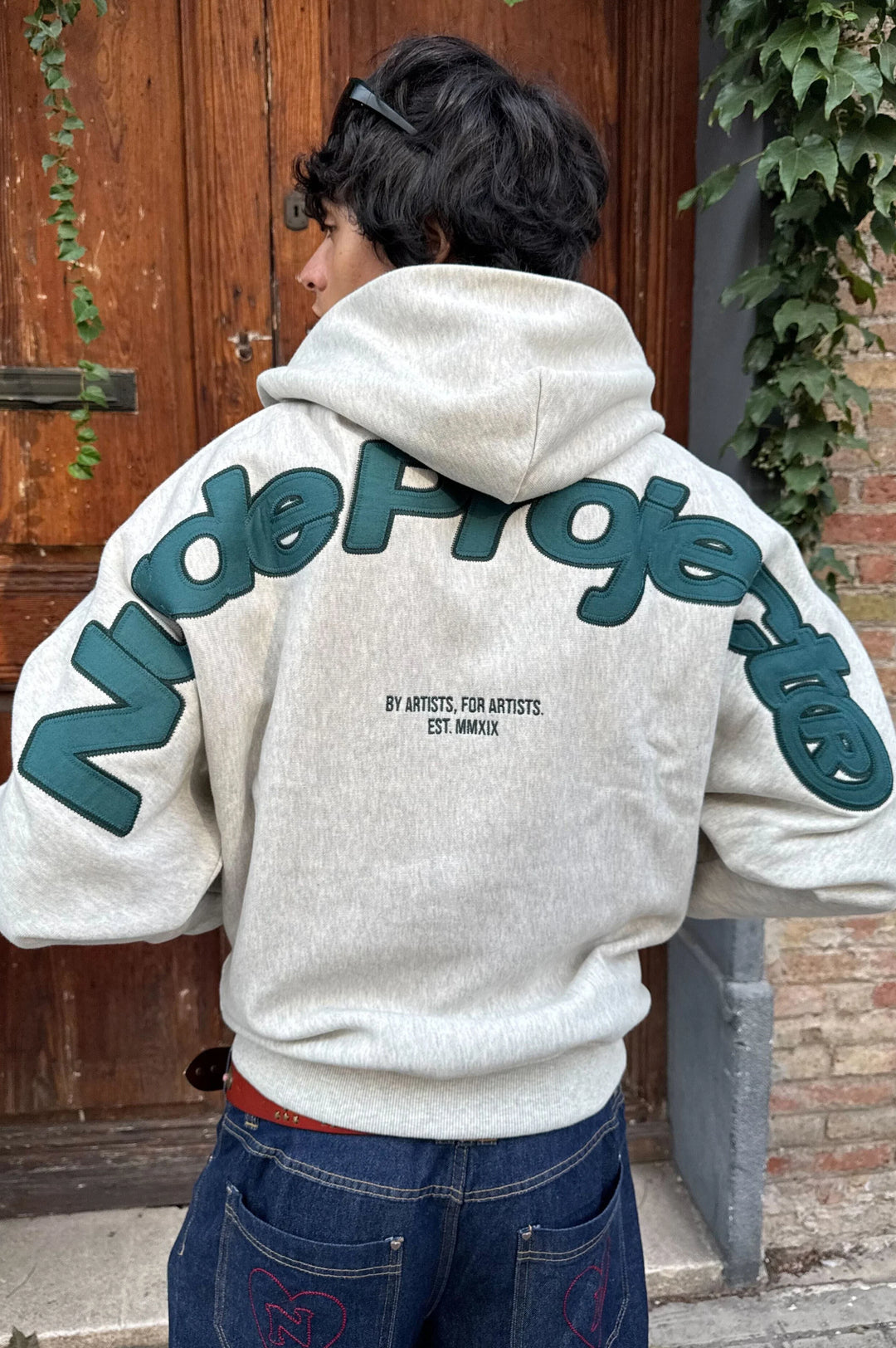Grey graphic zip-up hoodie with hood and lettering