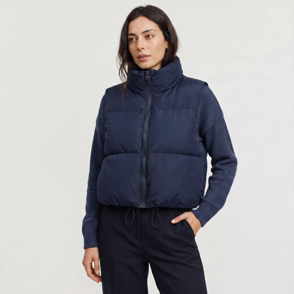 Women's cropped padded gilet with hooded collar, front zip and adjustable hem