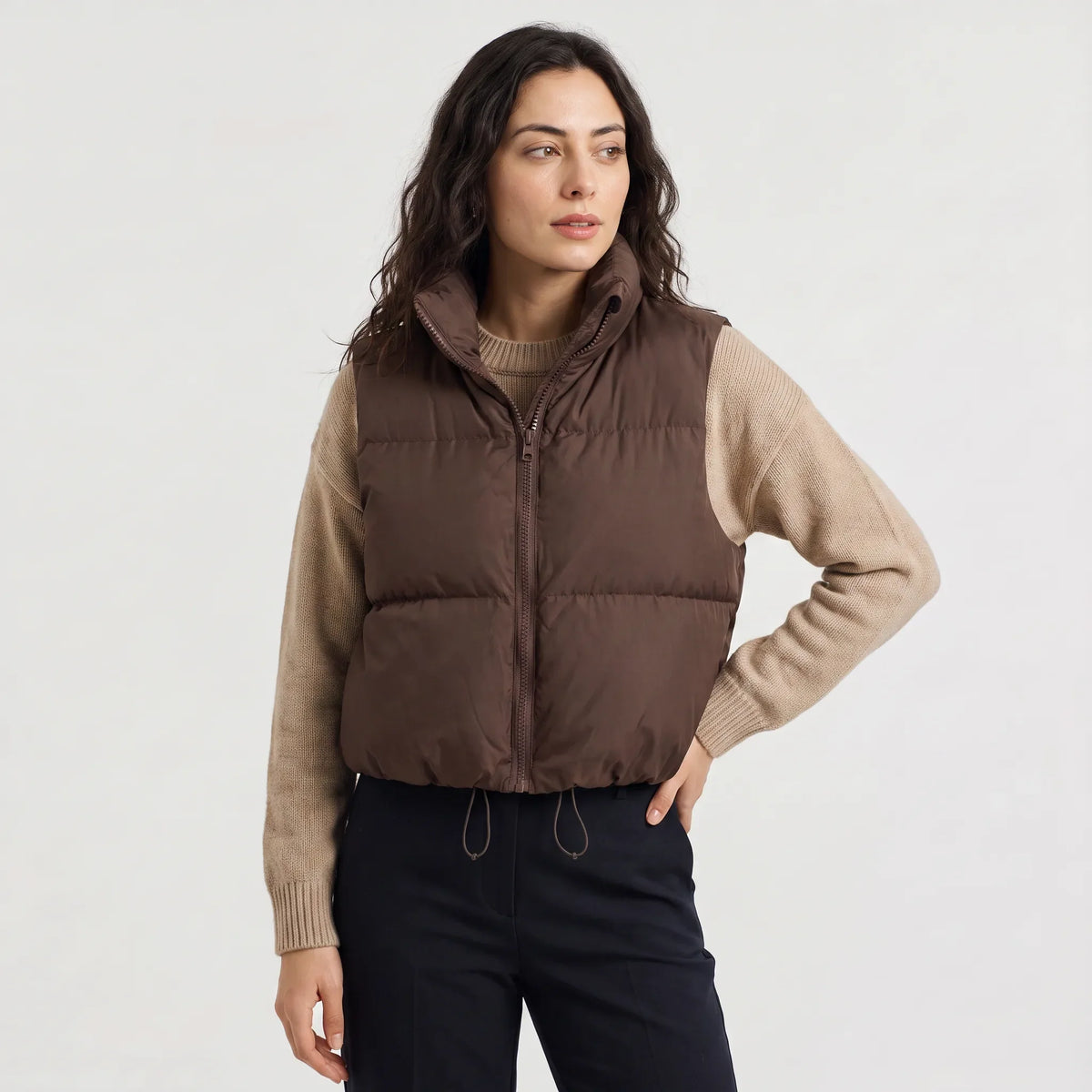 Women's cropped padded gilet with hooded collar, front zip and adjustable hem