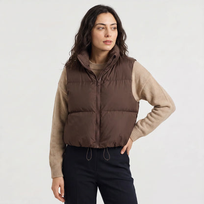 Women's cropped padded gilet with hooded collar, front zip and adjustable hem