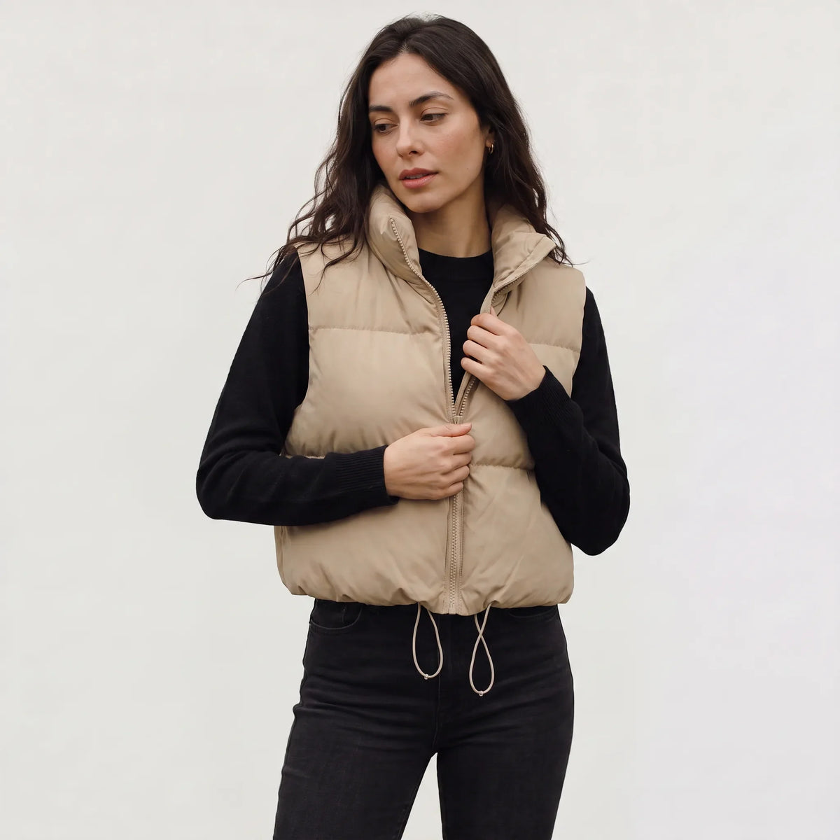 Women's cropped padded gilet with hooded collar, front zip and adjustable hem