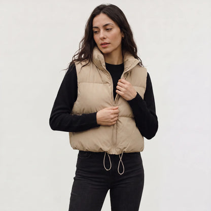 Women's cropped padded gilet with hooded collar, front zip and adjustable hem