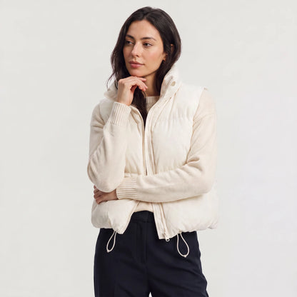 Women's cropped padded gilet with hooded collar, front zip and adjustable hem