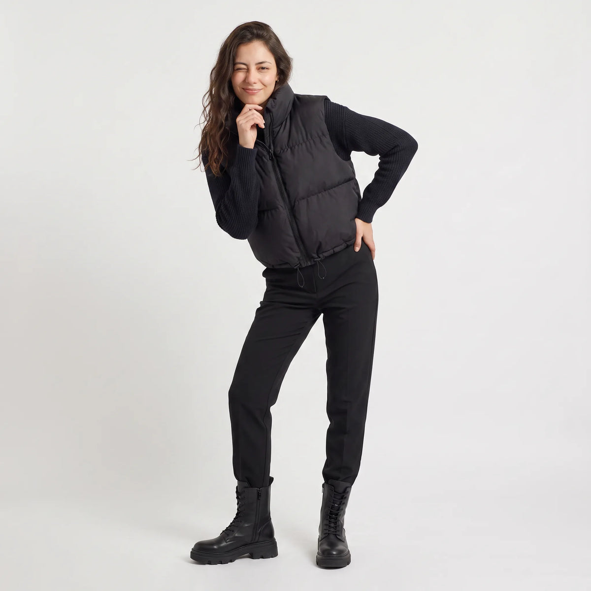 Women's cropped padded gilet with hooded collar, front zip and adjustable hem