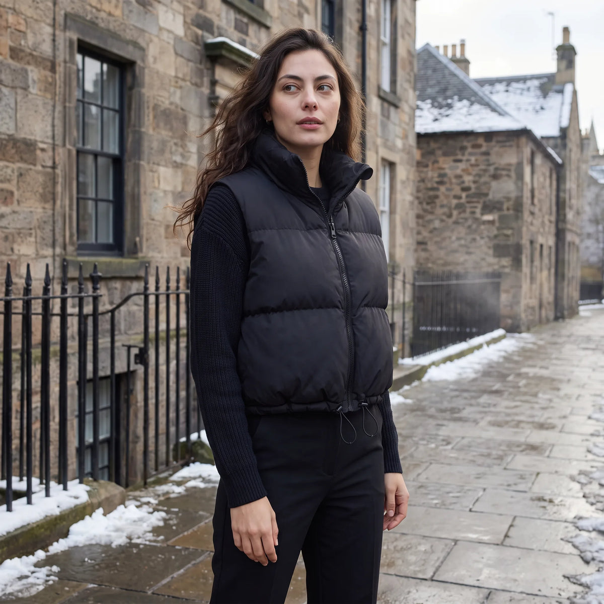 Women's cropped padded gilet with hooded collar, front zip and adjustable hem