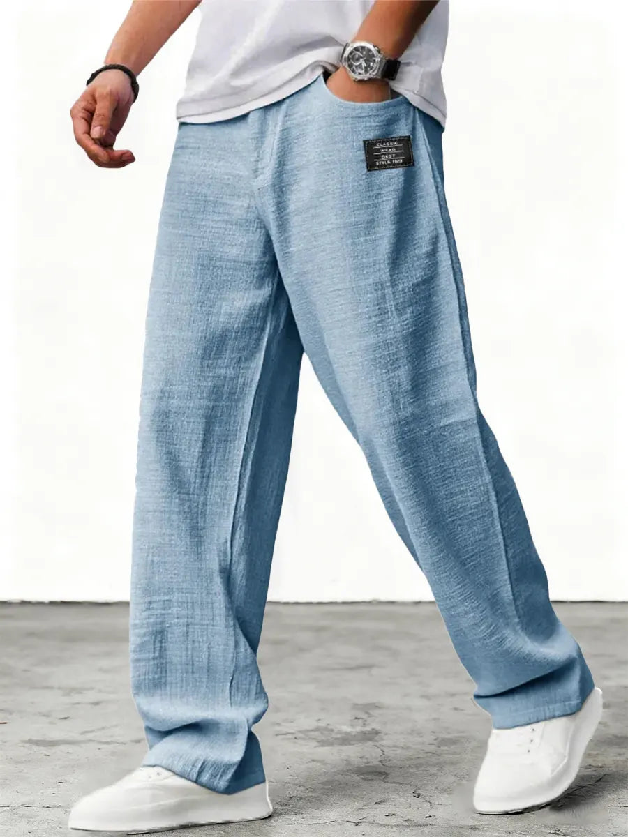 Men's relaxed fit wide leg summer trousers in blue with flat front waist and textured finish