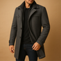 Men's long structured coat with raised collar, zip and button front