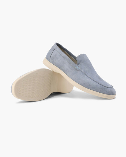 Slip-on loafers with almond toes, moc stitching and raised wedge soles