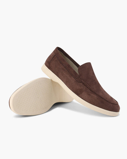 Slip-on loafers with almond toes, moc stitching and raised wedge soles