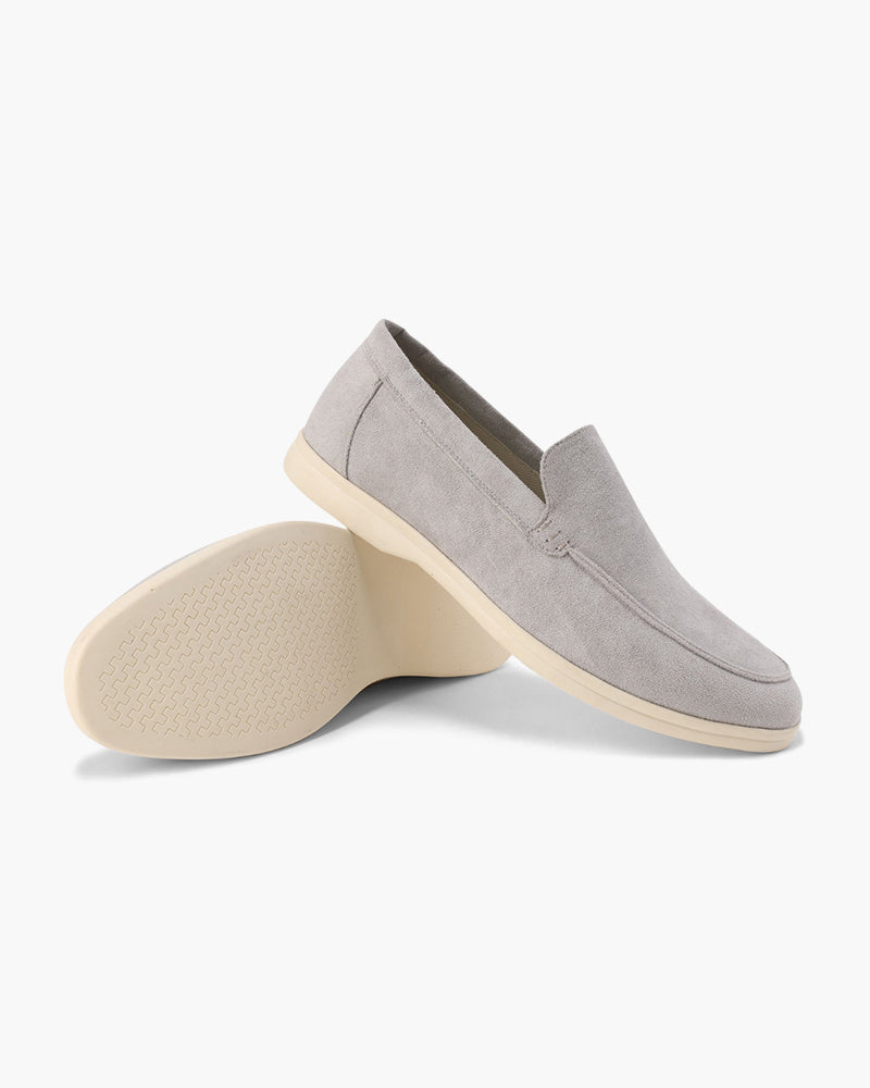 Slip-on loafers with almond toes, moc stitching and raised wedge soles