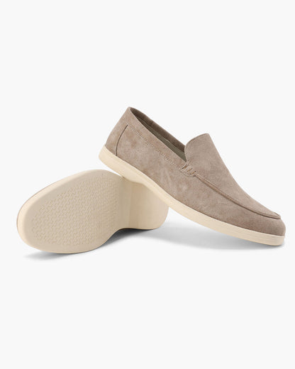 Slip-on loafers with almond toes, moc stitching and raised wedge soles