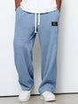 Men's wide leg textured trousers with drawstring waist, shown in blue and cream variants