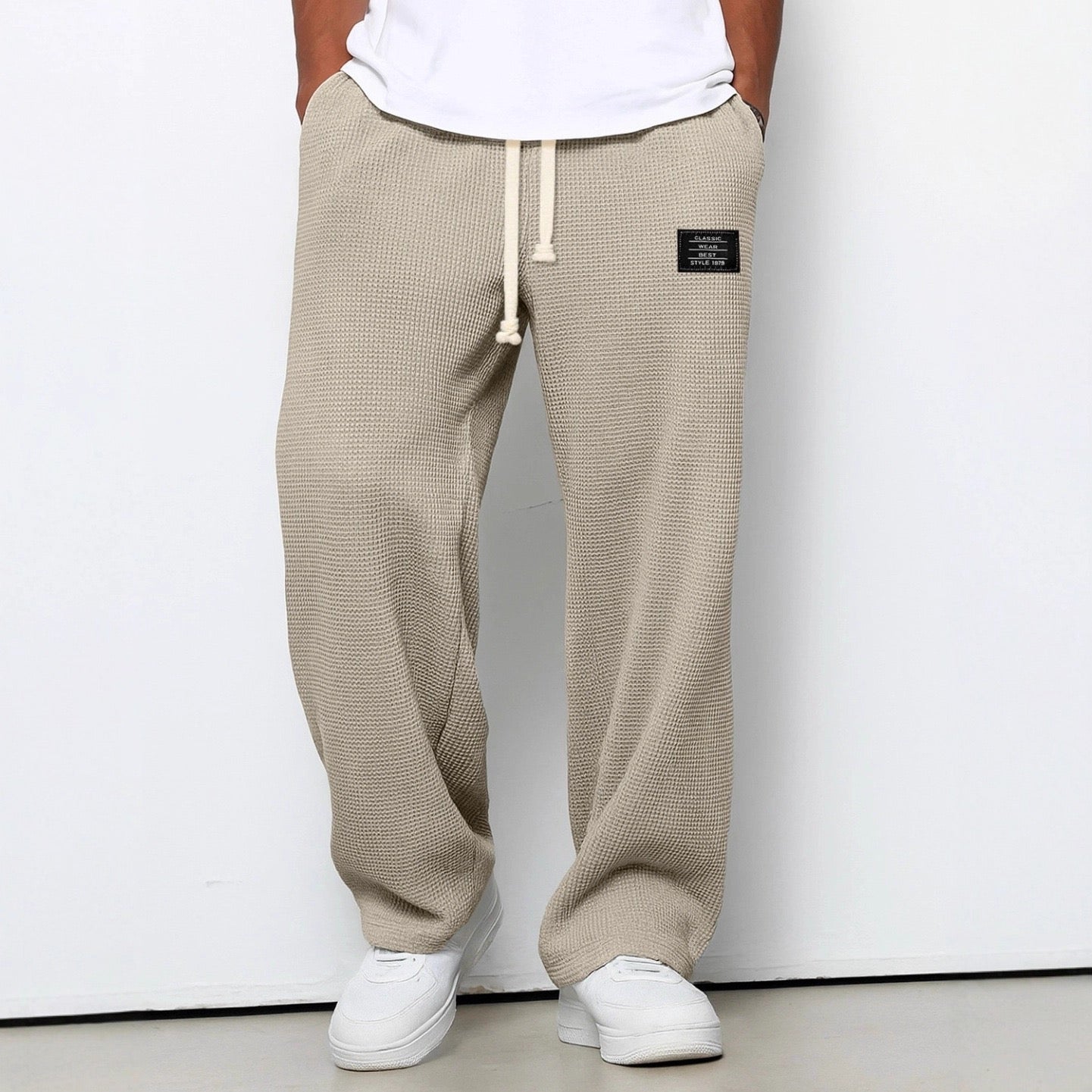 Men's wide leg textured trousers with drawstring waist, shown in blue and cream variants
