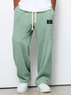 Men's wide leg textured trousers with drawstring waist, shown in blue and cream variants