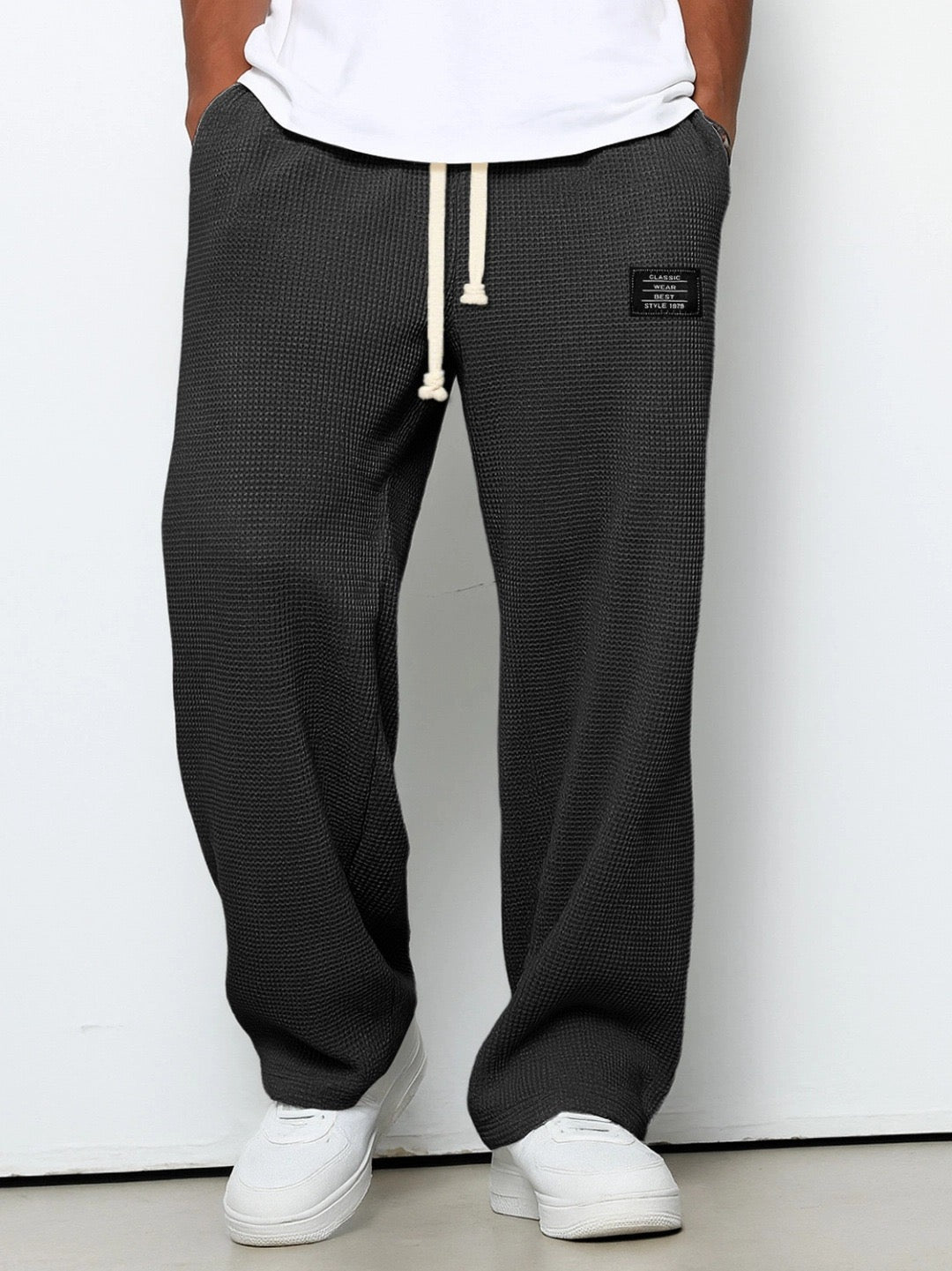 Men's wide leg textured trousers with drawstring waist, shown in blue and cream variants