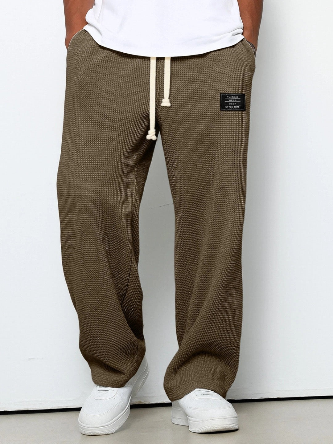 Men's wide leg textured trousers with drawstring waist, shown in blue and cream variants