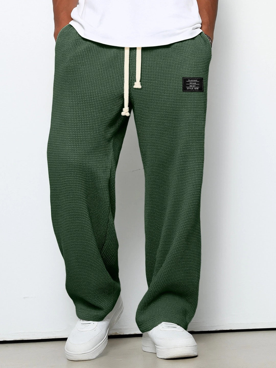 Men's wide leg textured trousers with drawstring waist, shown in blue and cream variants