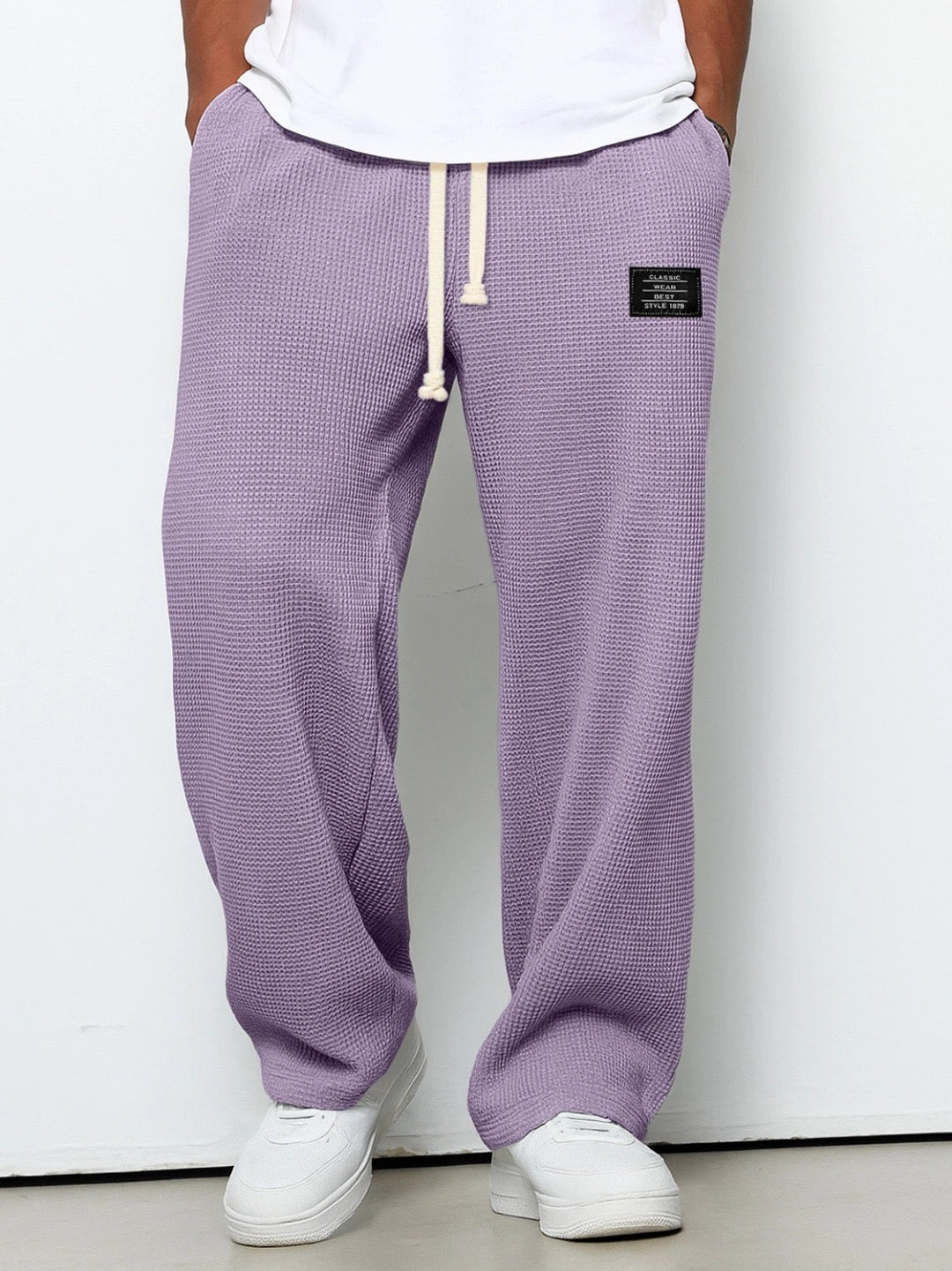 Men's wide leg textured trousers with drawstring waist, shown in blue and cream variants