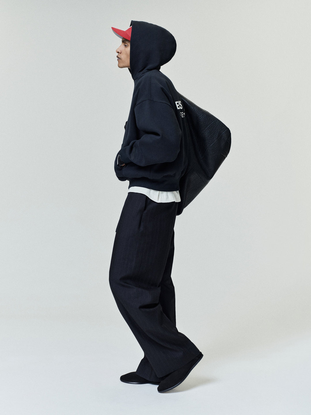 Black pullover hoodie with kangaroo pocket and back text graphic