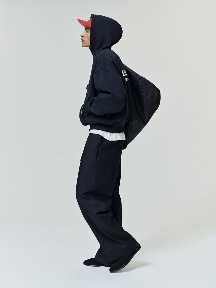 Black pullover hoodie with kangaroo pocket and back text graphic
